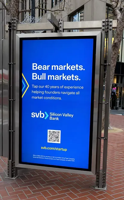 Silicon Valley Bank transit-shelter ad reading 'Bear markets. Bull markets.' with a QR code to svb.com/startup